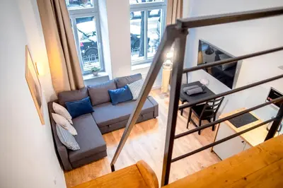 an overhead view of a living room with a couch at Piano Apartments in Kraków