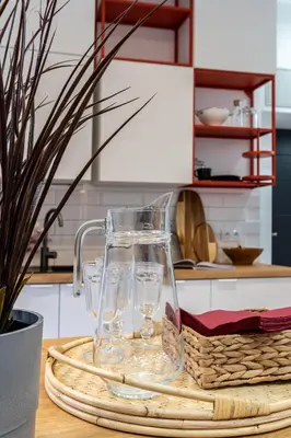 a glass vase sitting on top of a table at Apartment near Main Station - Bosacka 8 street in Kraków