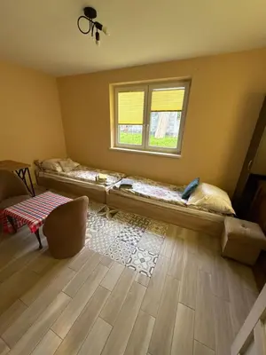 a room with a bed and a window at Rancho w Dolinie in Skomielna Biała