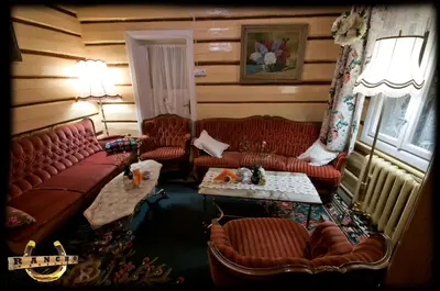 a living room with couches and chairs and a table at Rancho w Dolinie in Skomielna Biała