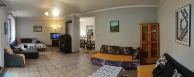 a living room with a couch and a table at Kwatery U Adama Zawoja in Zawoja