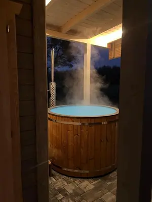 a jacuzzi tub with a painting of a smoke stack at Piekielne zacisze in Klecza Dolna