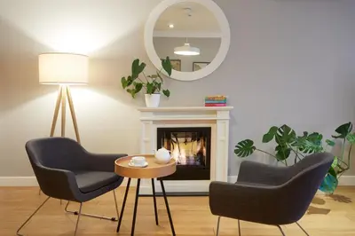 a living room with a couch and a bed at STRADONIA Serviced Apartments in Kraków