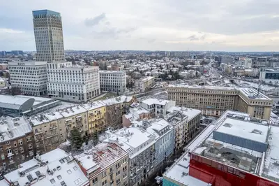 an aerial view of a city with snow covered buildings at Kraków Grzegórzki Studio - Central Station Nearby - by Rentujemy in Kraków