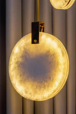 a yellow circle hanging from a ceiling at Exclusive Apartment with Parking by Renters Prestige in Kraków