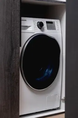 a white washing machine sitting on a shelf at Exclusive Apartment with Parking by Renters Prestige in Kraków