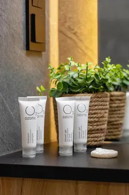 three cups sitting on a table with a potted plant at Exclusive Apartment with Parking by Renters Prestige in Kraków