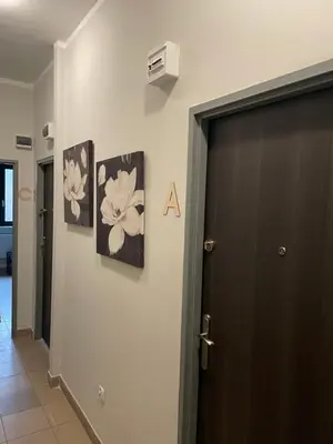 a door to a room with two pictures on the wall at Noclegi Eliza in Dąbrowa Górnicza