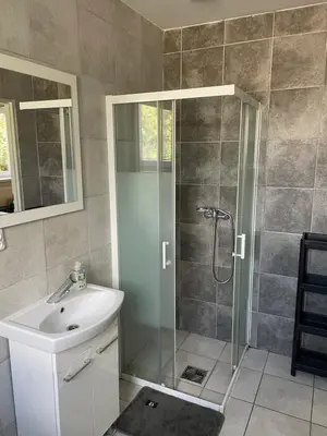 a bathroom with a shower and a sink at Noclegi Eliza in Dąbrowa Górnicza