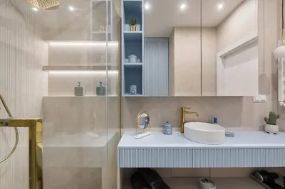 a bathroom with a sink and a mirror at Apartment Blue near Schindler in Kraków