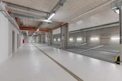 an empty parking lot in a parking garage at Metropolis Design Apartments in Kraków