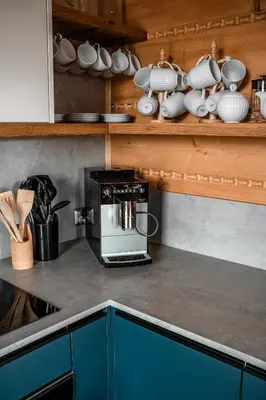 a kitchen counter with a coffee maker and utensils at Makowy Zakątek in Maków Podhalański