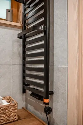 a wall mounted wood stove in a kitchen at Makowy Zakątek in Maków Podhalański
