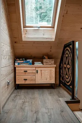 a room with a dresser and a window at Makowy Zakątek in Maków Podhalański
