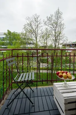a bowl of fruit on a table on a balcony at Comfort Apartment in great location in Kraków