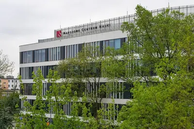a building with a sign on the side of it at Comfort Apartment in great location in Kraków