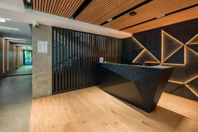 a lobby with a reception desk in a building at High standard in top location in Kraków