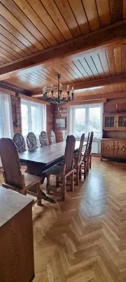a dining room with a large table and chairs at Górnica apart in Andrychów