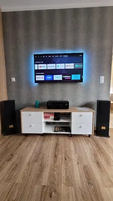 a living room with a flat screen tv on a wall at Nowa Huta 12 in Kraków