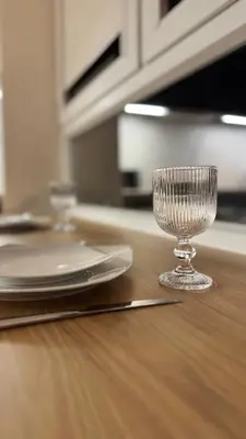 a wine glass sitting on top of a table at Nowa Huta 12 in Kraków