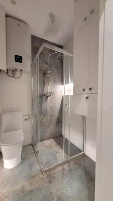 a bathroom with a shower and a toilet at Nowa Huta 12 in Kraków