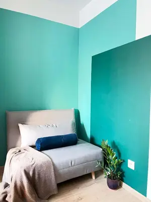 a blue room with a bed with a blue wall at Apartment with Terrace and Two Bedrooms, Cracow Vistula Boulevards in Kraków