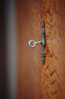 a close up of a wooden door with a handle at Mikołajska Apartment 2 in Kraków