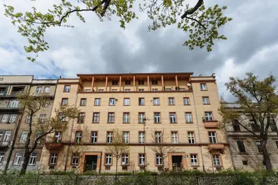 an old building in a city with trees at Basztowa 5a in Kraków
