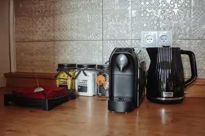 a coffeemaker and a coffee maker on a table at Basztowa 5a in Kraków