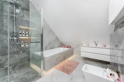 a bathroom with a shower and a bath tub at ZinHouse Wojakowa in Wojakowa