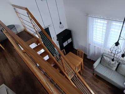 an overhead view of a living room with a wooden staircase at Bukszpanowa Alejka domek całoroczny, okolica Ojcowski Park Narodowy in Milonki
