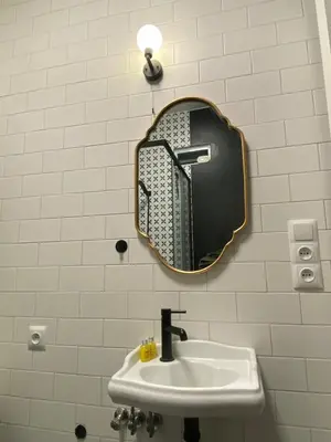 a bathroom with a sink and a mirror on the wall at Krakow Center - Chill Spot by the River in Kraków