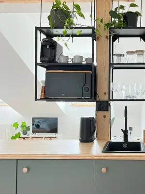 a kitchen with a counter with plants and a sink at Premium Jacuzzi with Air conditioning, Main Square Cracow in Kraków