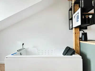a white kitchen with a sink and a counter at Premium Jacuzzi with Air conditioning, Main Square Cracow in Kraków