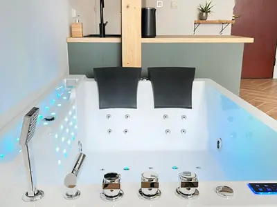 a bath tub with two chairs in it at Premium Jacuzzi with Air conditioning, Main Square Cracow in Kraków