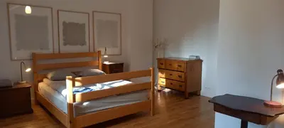 a bedroom with two bunk beds and a dresser at Nowy Dwór w Goszycach in Goszyce