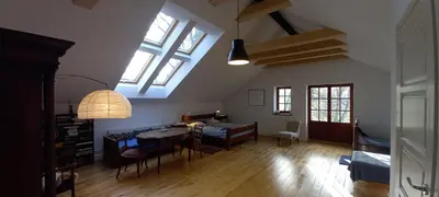 a living room with a table and a dining room at Nowy Dwór w Goszycach in Goszyce