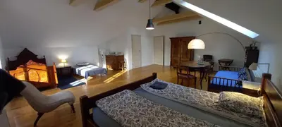 a living room with a couch and a dining room at Nowy Dwór w Goszycach in Goszyce