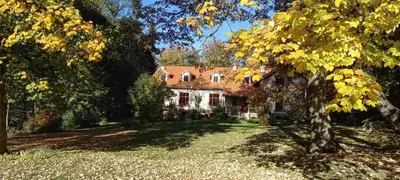 a large house with a tree in front of it at Nowy Dwór w Goszycach in Goszyce