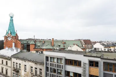 a view of a city with a clock tower at Silver Suite Old Town Apartament in Kraków