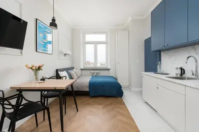 a kitchen with a bed and a table in a room at Silver Suite Old Town Apartament in Kraków