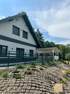a white building with a tent in front of it at Willa Sielski Zakątek in Raba Wyżna