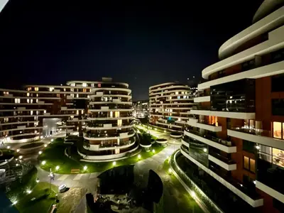 a view of a city at night with buildings at Wiślane Tarasy 2 VIP Apartamenty JACUZZI in Kraków