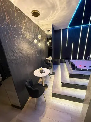 a dining room with a ping pong table and a pool at Wiślane Tarasy 2 VIP Apartamenty JACUZZI in Kraków