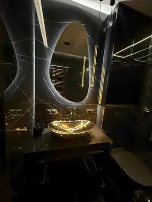 a bathroom with a sink and a mirror at Wiślane Tarasy 2 VIP Apartamenty JACUZZI in Kraków