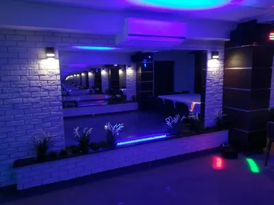 a room with purple lights and a bar at Willa Relaks in Wieliczka