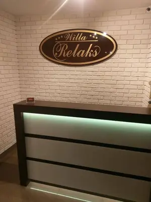a sign on the wall of a restaurant at Willa Relaks in Wieliczka
