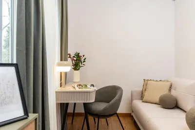 a living room with a couch and a chair at Your private oasis in Cracow in Kraków