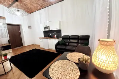 a living room with a couch and a table at Old Town Apartment Lubicz Street L2a in Kraków