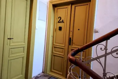 a door with the number on it next to a staircase at Stary Krakow - Sołtyka S2a in Kraków